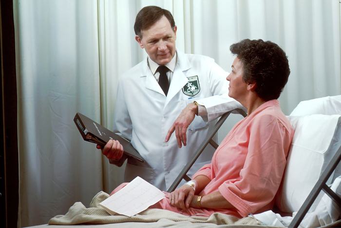 A doctor reviewing progress with a recovering patient